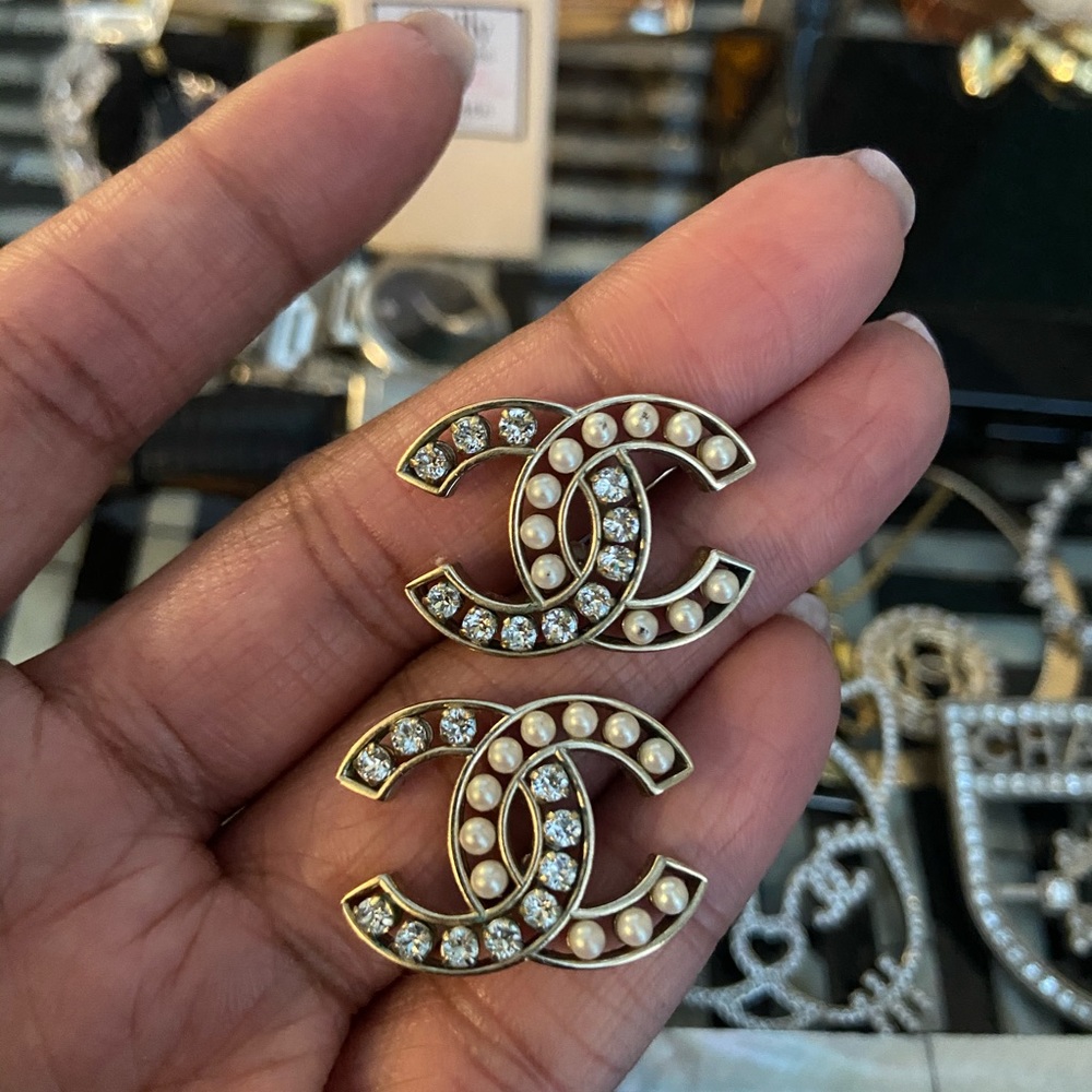 Chanel logo pearl and crystal stud earrings.